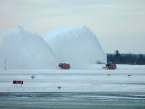 Cleaning the runway of snow using ploughs and blowers